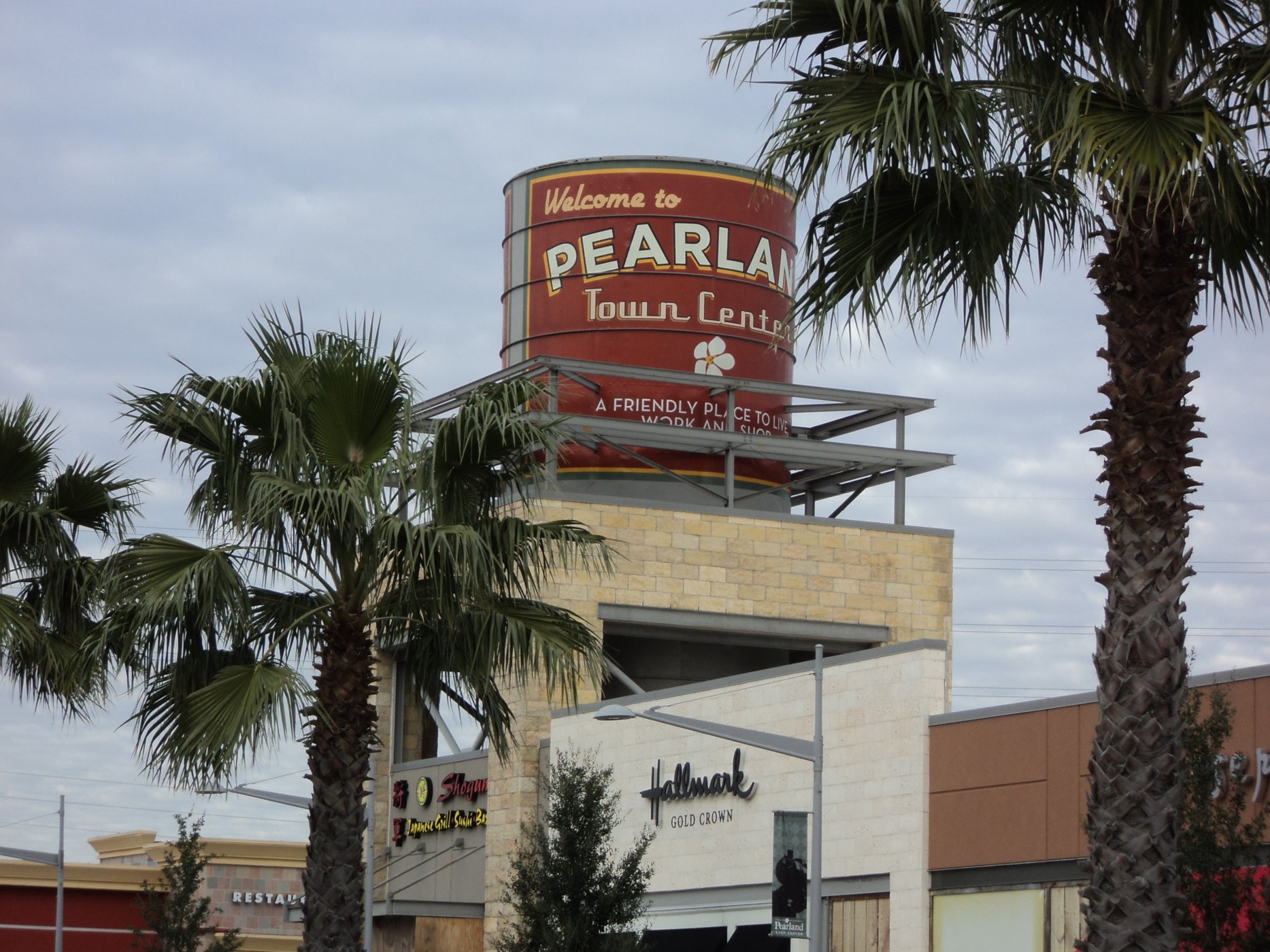 Pearland Town Center sign with palm trees, photographed in 2011